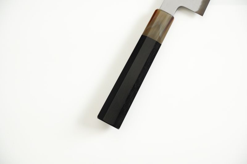 Dark ebony with white buffalo horn ferrule